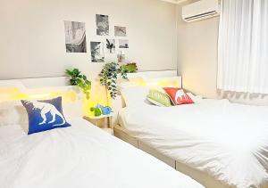 Ένα ή περισσότερα κρεβάτια σε δωμάτιο στο D House Seoul