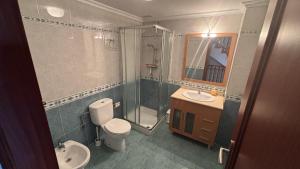 a bathroom with a toilet and a shower and a sink at Casa Frijol 20metres from the beach in Los Alcázares +30 photos