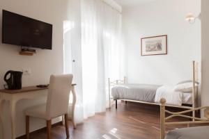 Posteľ alebo postele v izbe v ubytovaní Donna Margherita Rome Suite & Rooms
