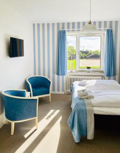 Postel nebo postele na pokoji v ubytování Hotel Højbysø