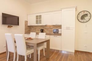 Kuchyňa alebo kuchynka v ubytovaní Donna Margherita Rome Suite & Rooms