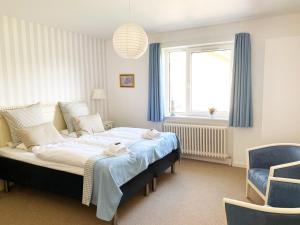 Postel nebo postele na pokoji v ubytování Hotel Højbysø