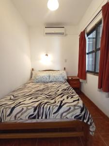 a bedroom with a bed in a room at Residencial Shalom in Cafayate