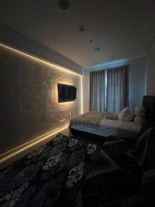 TV a/nebo společenská místnost v ubytování Apartment Borneo Bay City - Asnah Property