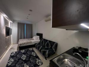 Postel nebo postele na pokoji v ubytování Apartment Borneo Bay City - Asnah Property