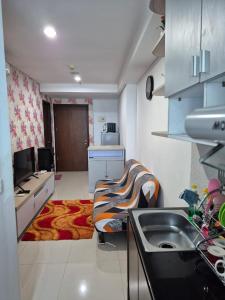 Kuchyň nebo kuchyňský kout v ubytování Apartment Borneo Bay City - Asnah Property