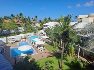 an aerial view of a resort with a swimming pool at Hotel Vivenda dos Corais in Porto De Galinhas