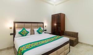 Postel nebo postele na pokoji v ubytování Treebo Brij Kaushal, Near Prem Mandir + 33 fotografií