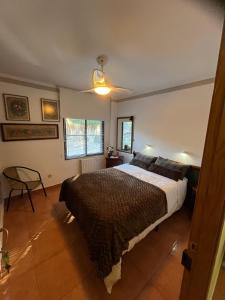 a bedroom with a bed and a chair in it at Mi Refugio in Alicante