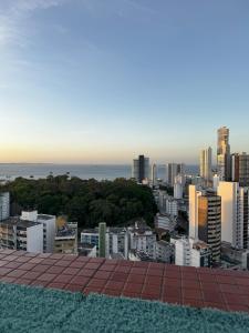 a view of the city from the roof of a building at Flat Mobiliado na Barra in Salvador +5 photos