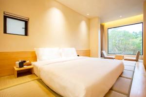 Postel nebo postele na pokoji v ubytování Shanghai Xingshe Camping B&B Disney Branch
