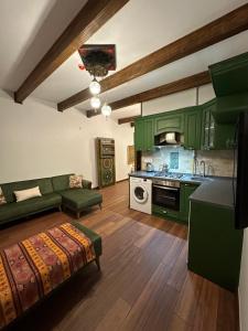 a living room with green cabinets and a kitchen at Saint Johns Hill Boutique Ephesus in Selçuk +109 photos