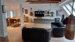 a living room with a couch and a table at Haus Moritzburg in Bad Schandau