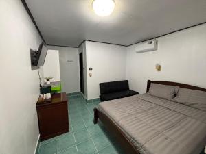 Ένα ή περισσότερα κρεβάτια σε δωμάτιο στο Alanta aonang resort