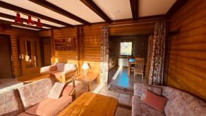 a living room with a couch and a table at Haus Sonnenblick in Arrach