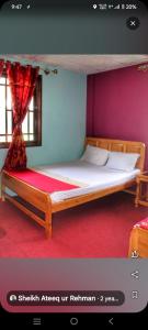 a bedroom with a bed with at The Tourists Inn in Chak