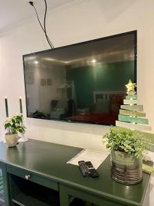 TV a/nebo společenská místnost v ubytování Gästezimmer Seckert Wohlfühlen in der Nähe von MAINZ