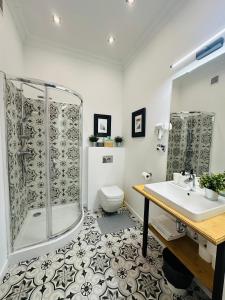 a bathroom with a shower and a toilet and a sink at Apartamenty Narutowicza 52 parking free in Lublin