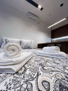 Postel nebo postele na pokoji v ubytování IL PRIMO Studio Apartment