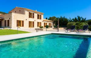 a villa with a swimming pool in front of a house at Pula Bonavista Ref 140 in Costa des Pins
