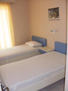 Voodi või voodid majutusasutuse Triantis Apartments toas