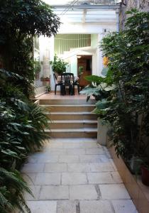 a set of stairs leading to a patio with plants at Apartments Ivica Split in Split