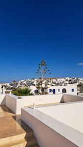 a view of the city from the roof of a house at Piperi On The Rocks in Naousa