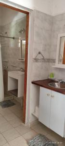 a bathroom with a sink and a shower at Sol y Paz Valle Grande San Rafael in San Rafael