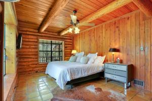 a bedroom with a bed and a ceiling fan at Rocky Mountain in New Braunfels