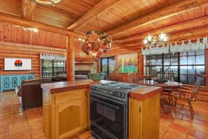 a kitchen with a stove and a dining room at Rocky Mountain in New Braunfels