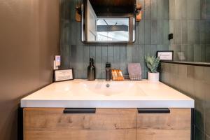a bathroom with a sink and a mirror at Texas Retreat - Sunset Rock in Wimberley