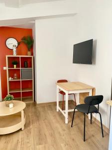 Televiisor ja/või meelelahutuskeskus majutusasutuses Beau T3 Spacieux, lumineux et central