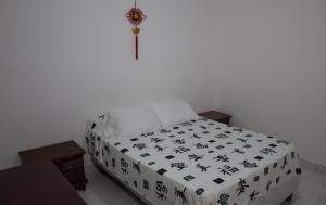 Postel nebo postele na pokoji v ubytování Hotel Beijing Cartagena