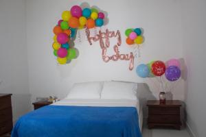 Postel nebo postele na pokoji v ubytování Hotel Beijing Cartagena