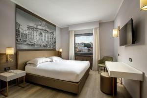 Postelja oz. postelje v sobi nastanitve Hotel Marc'Aurelio