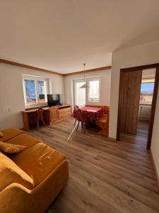 Posezení v ubytování Cèsa Carlotta by AMA Val di Fassa + 6 fotografií