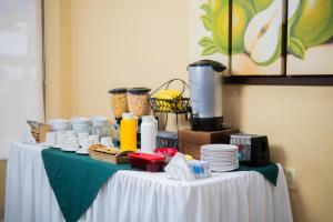 a table with food on top of a table at Hotel Du Parc in Poza Rica de Hidalgo
