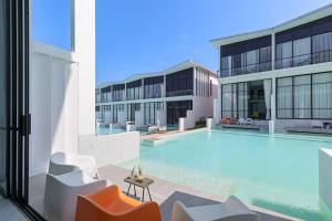 an image of a swimming pool in a building at Zen Style Pool Access Townhouse in Nathon Bay