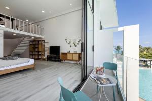 a bedroom with a bed and a swimming pool at Zen Style Pool Access Townhouse in Nathon Bay