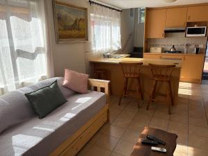 a living room with a couch and a kitchen at Morrison Hotel in Parklands