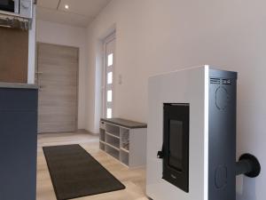 a kitchen with a refrigerator in a room at Ferienhaus - Fimo Haus in Nagel +13 photos