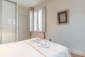 Ένα ή περισσότερα κρεβάτια σε δωμάτιο στο Superbe appartement de 2 chambres au cœur du quartier Gambetta