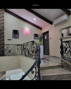 a balcony with a black railing and a door at Penthouse in Le Hamiz +32 photos