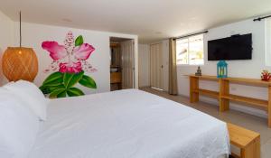 Postel nebo postele na pokoji v ubytování Hotel Arena Beach Cartagena