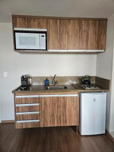 Kuchyň nebo kuchyňský kout v ubytování Flat Hotel Guarulhos Aeroporto GRU