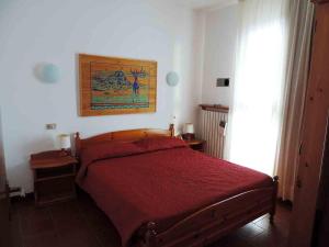 En eller flere senge i et værelse på appartamento in Residence Cervinia due