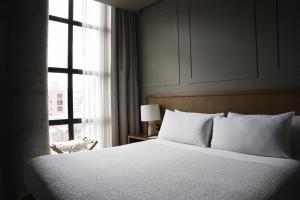 Postel nebo postele na pokoji v ubytování Hotel Coco