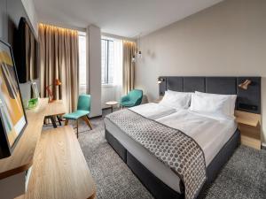 Postel nebo postele na pokoji v ubytování Clarion Hotel Vienna South