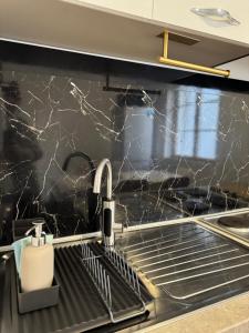 a kitchen with a sink and a counter top at Apartman Laros in Split +64 photos