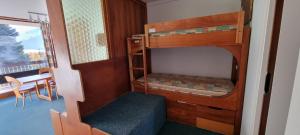 En eller flere senge i et værelse på Résidence Ski Azur